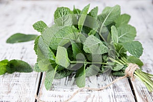 Mint. Bunch of Fresh green organic mint leaf on wooden table clo