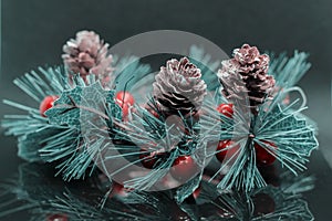 Mint christmas composition. Christmas tree and cones, reflection
