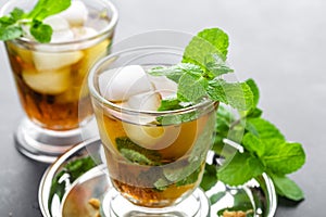 Mint Julep cocktail with bourbon, ice and mint in glass