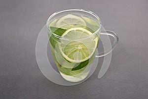 Mint Lemonade in a Glass Cup served with lemon slices and mint leaves