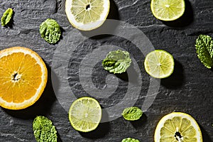 Mint, lime, ice, ingredients and bar utensils for making mojito cocktail