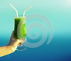 Mint Margarita Drink with sunlight and blue blur background, cool drink for summers.