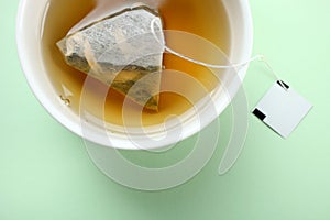 Mint tea bag in a cup