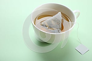Mint tea bag in a cup