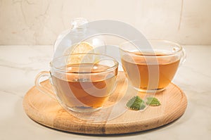 Mint tea in glass with lemon/ mint tea in glass with lemon on a