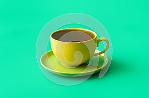 Mint tea in a yellow cup isolated on a green background