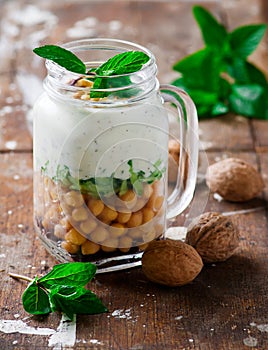 Minty yogurt parfaits in the jar.style rustic.