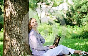 Minute for relax. Education technology and internet concept. Girl work with laptop in park sit on grass. Natural