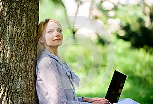 Minute for relax. Girl work with laptop in park sit on grass. Education technology and internet concept. Natural