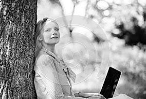 Minute for relax. Girl work with laptop in park sit on grass. Education technology and internet concept. Natural