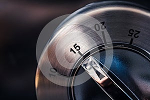 15 Minutes - Macro Of An Analog Chrome Kitchen Timer With Dark Background