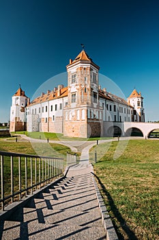Mir, Belarus. Towers Of Mir Castle Complex On Blue Sunny Sky Background. Architectural Ensemble Of Feudalism