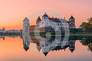 Mir Castle and its reflection against the purple sunset sky, Belarus