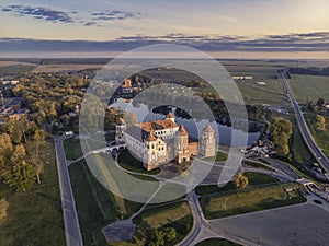 Mir castle in the sunsetlight. Drone aerial photo