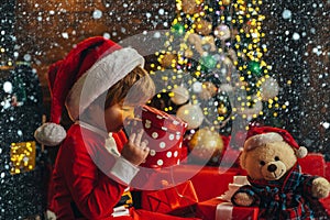 It is miracle. Boy cute child cheerful mood play near christmas tree. Merry and bright christmas. Santa boy little child