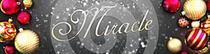 Miracle and Christmas,fancy black background card with Christmas ornament balls, snow and an elegant word Miracle, 3d illustration