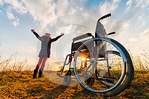 Miracle recovery II: young girl gets up from wheelchair and raises hands up