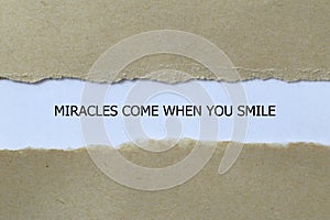 miracles come when you smile on white paper