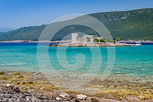 Mirista small fortress on the island in turquoise Adriatic bay