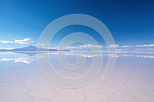 Miror effect and reflection of mountain in Salar de Uyuni Uyuni salt flats, Potosi, Bolivia South America