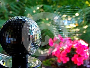 Mirror ball and its reflection in the window photo