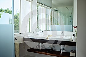 Mirror, bathroom and toilet interior in home, house and luxury hotel for beauty, skincare and cleaning. Reflection in