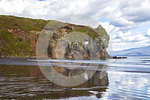 Mirror beach and rocks in Kasatka Bay, Iturup, South Kuril Islands