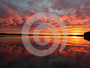 Mirror calm lake at sunset