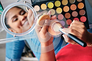 Mirror Close-Up Of Young Woman Applying Make-Up For Beauty