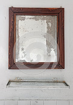 Mirror in a dilapidated bathroom