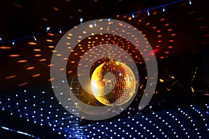 Mirror disco ball with light reflection on the ceiling