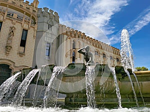 Mirror effect of a fountain reflected in a puddle of water. Ornamentation of parks and gardens.