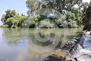 A mirror image of the Jordan River in the Kfar Blum Dam in Israel