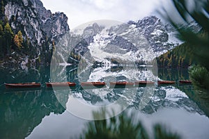 Mirror lake in Alpine mountains, Lago di Braies photo