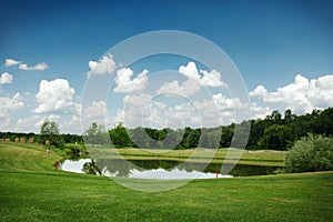 Mirror lake, lawn for golfing on golf course