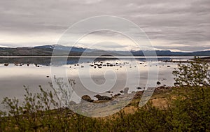 Mirror-like, calm waters of Porsangerfjord, Northern Norway photo