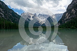 Mirror-like surface of Lago Di Landro, Dolomites, Italy photo
