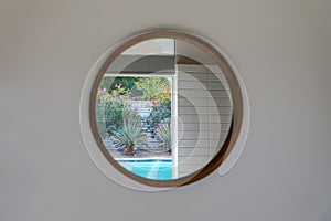 Mirror reflecting Palm Springs pool scene