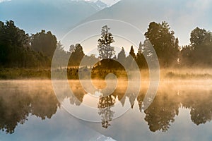 Mirror reflection water Matheson lake, New Zealand