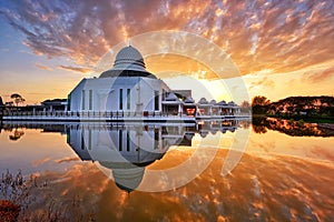 Mirror reflections of beautiful mosque at sunrise