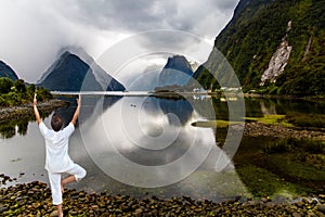 Mirror-smooth fiord water reflects mountains