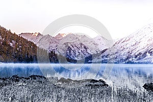 Mirror surface of the mountain lake. Beautiful nature, a trip to the mountains in a national Park in Altai Republic