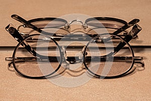 mirrored glasses with an eyeglass frame in a John Lennon style