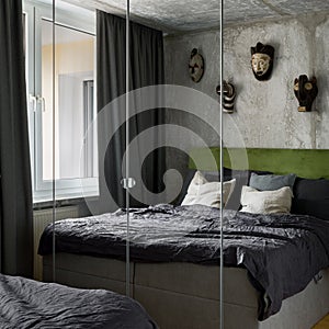 Mirrored wardrobe in small bedroom