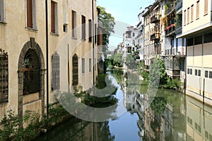 Mirroring houses in canal of Padua, Italy