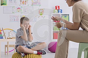 Misbehaving boy during session with a psychotherapist