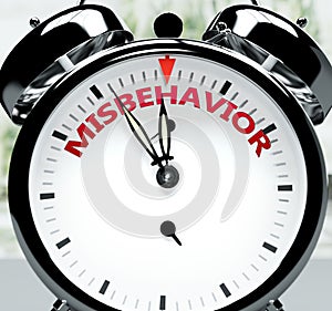 Misbehavior soon, almost there, in short time - a clock symbolizes a reminder that Misbehavior is near, will happen and finish