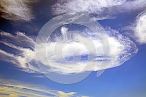 Polarised round cloud and blue sky. photo