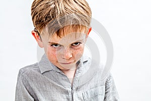 Mischievous bully child expressing revenge, retaliation or attitude problem, isolated photo