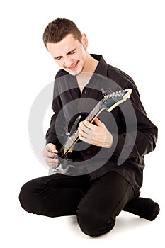 Mischievous guy plays the electric guitar